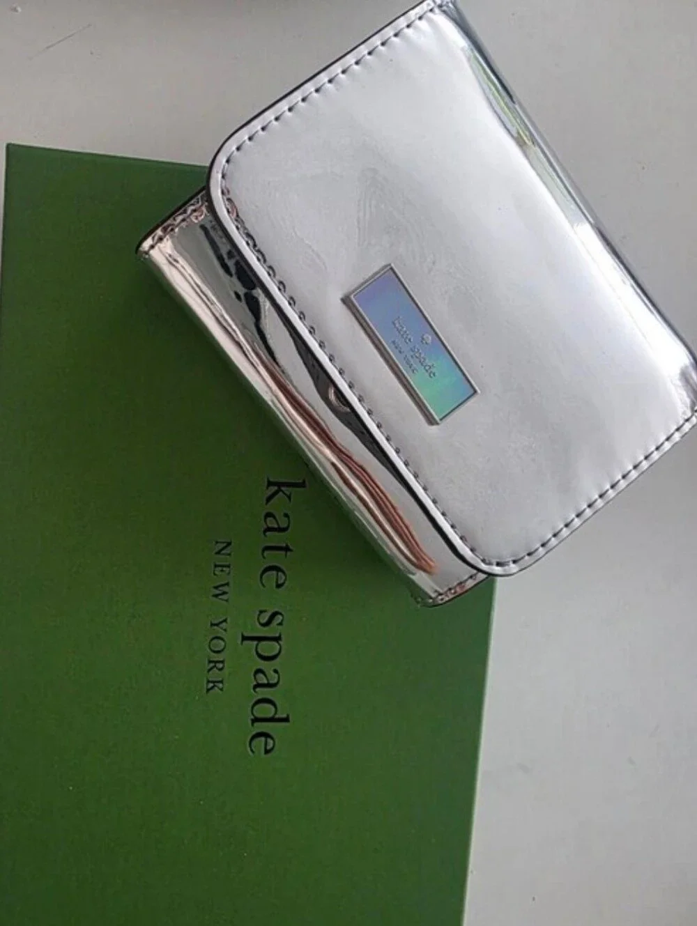 kate spade Silver Metallic Compact Card Wallet with Iridescent Logo Plaque